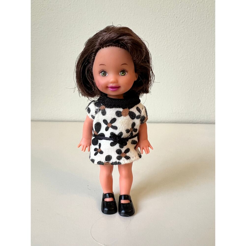 Vintage Kelly Barbie's baby sister wearing a Patterned Dress Mattel 1990s
